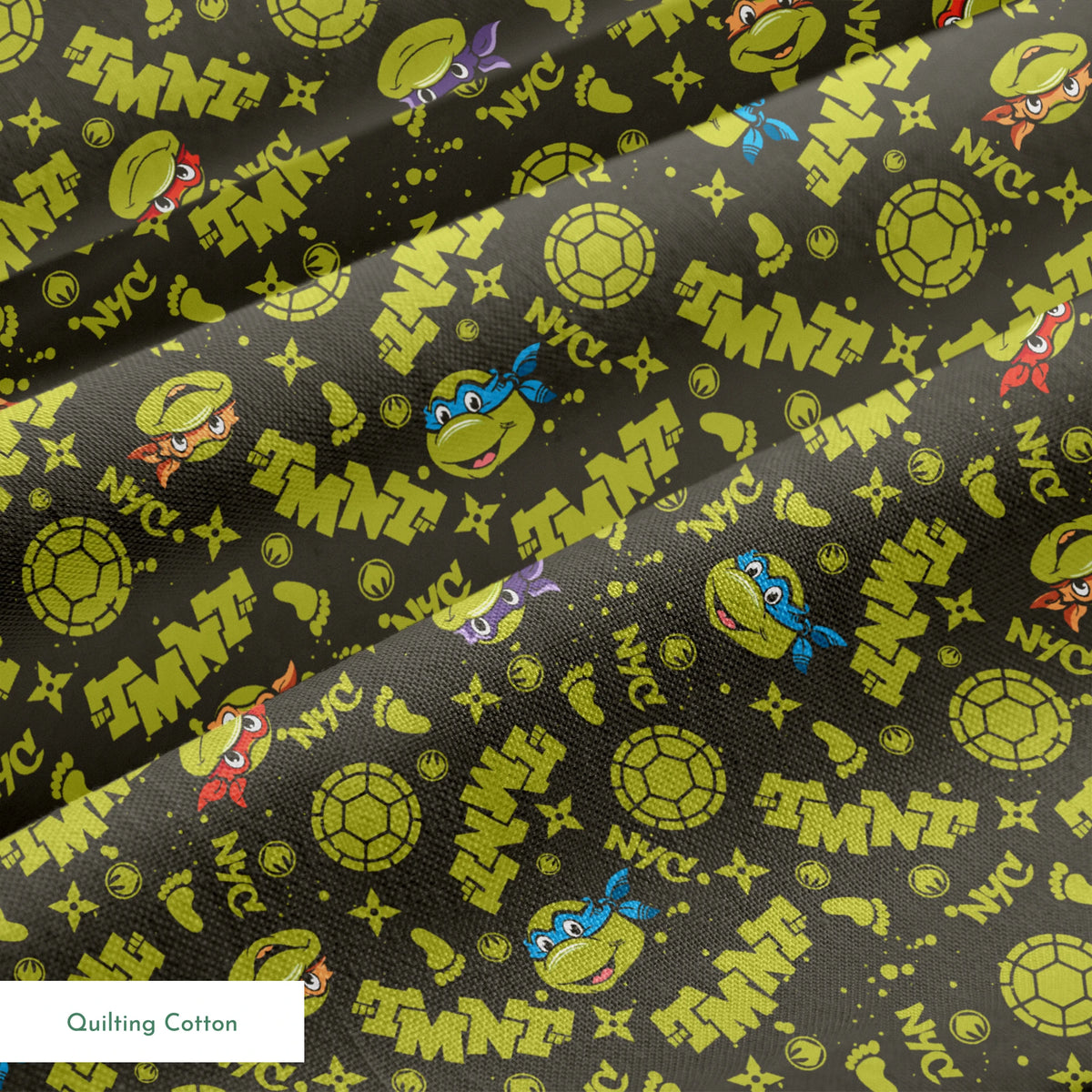 Pattern of Teenage Mutant Ninja Turtles with "TMNT" text on dark background springs quiltingcotton texture