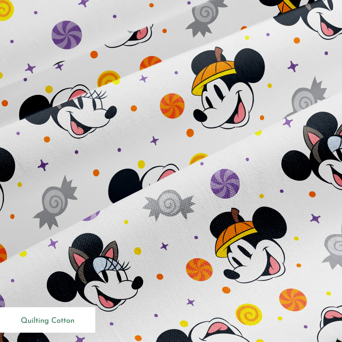 Mickey and Minnie Mouse cartoon heads scattered with wrapped candies and colorful dots on white background springs quiltingcotton texture