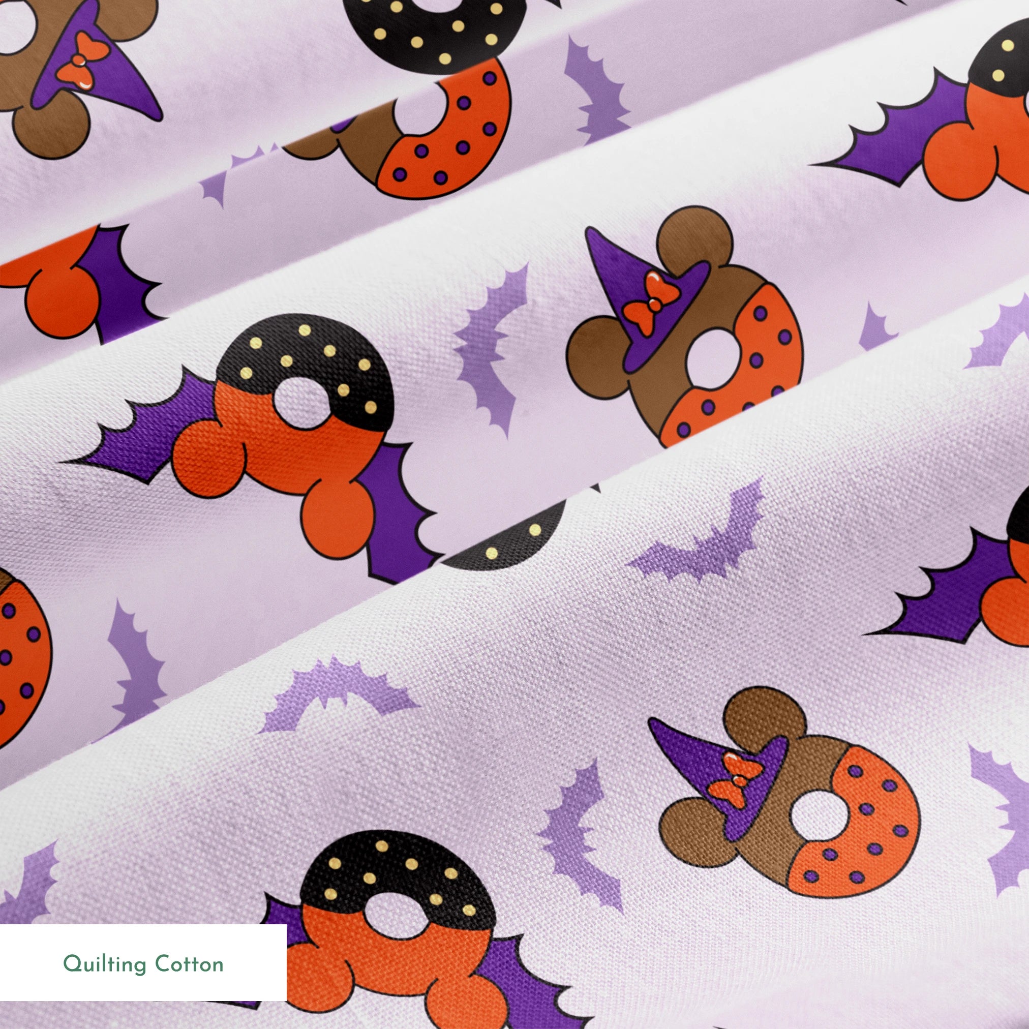 Disney Halloween-themed pattern with orange and black donuts, purple bat wings, and light purple bats on lavender background springs quiltingcotton texture