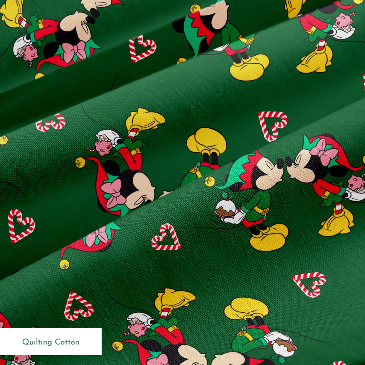 Festive Mickey Mouse pattern with candy canes on green background springs quiltingcotton texture
