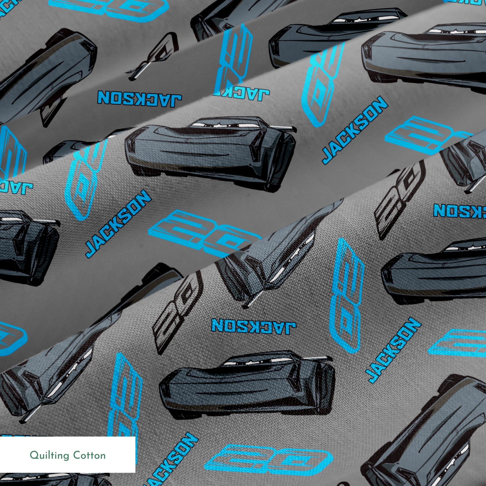 Dark gray background with scattered black car parts and blue "JACKSON" text and stylized logos in a repeating pattern springs quiltingcotton texture