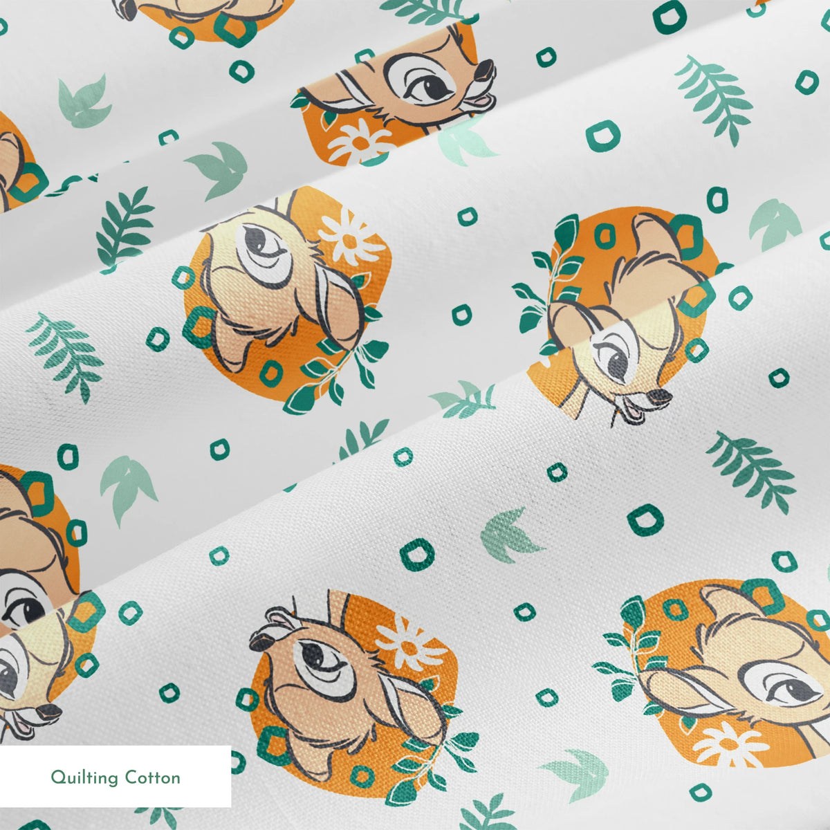 Disney’s Bambi illustrated in golden-orange floral medallions with green leaves and scattered geometric accents on a white background. springs quiltingcotton texture