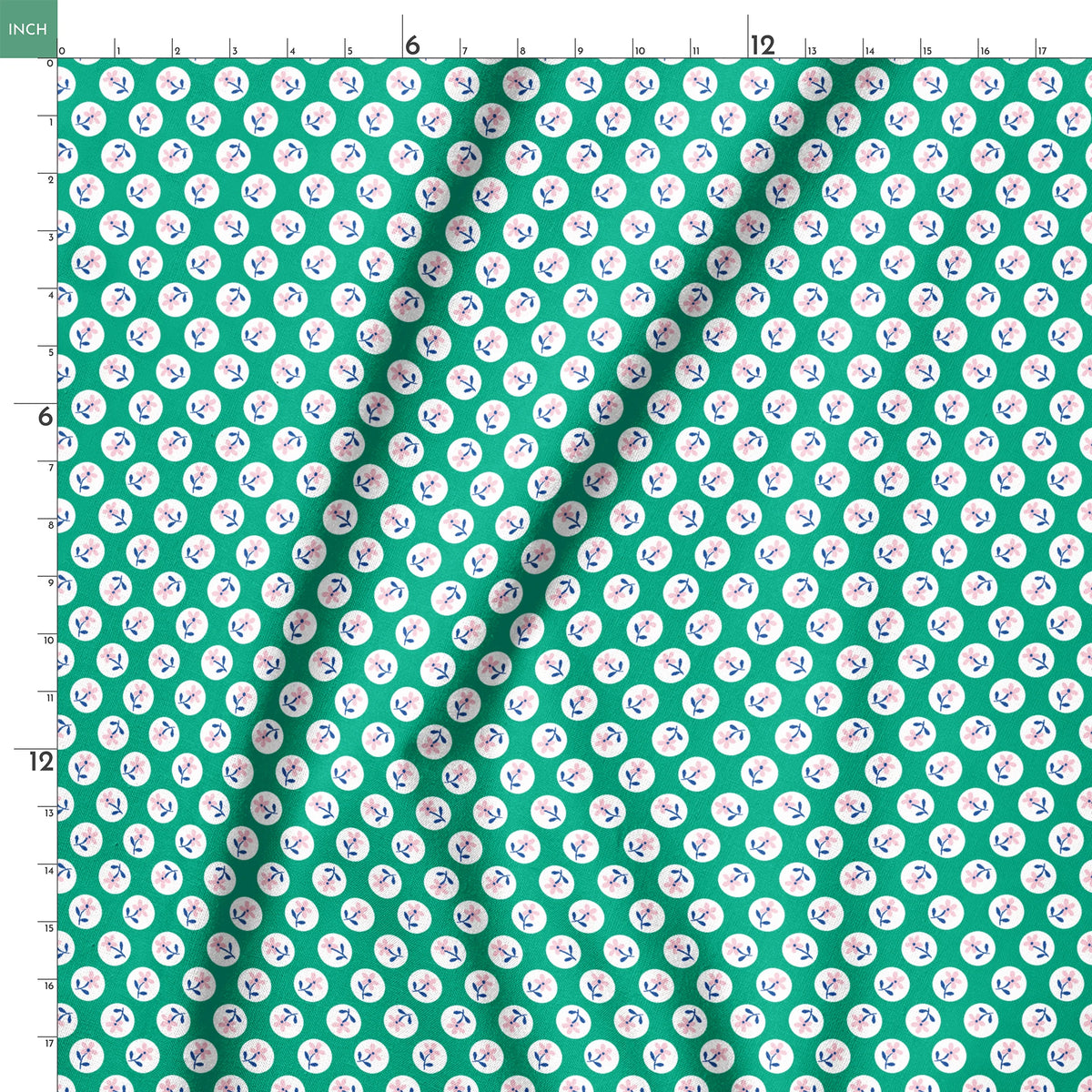 Pink flower motifs with blue stems on white circles against a green background springs ruler 18x18