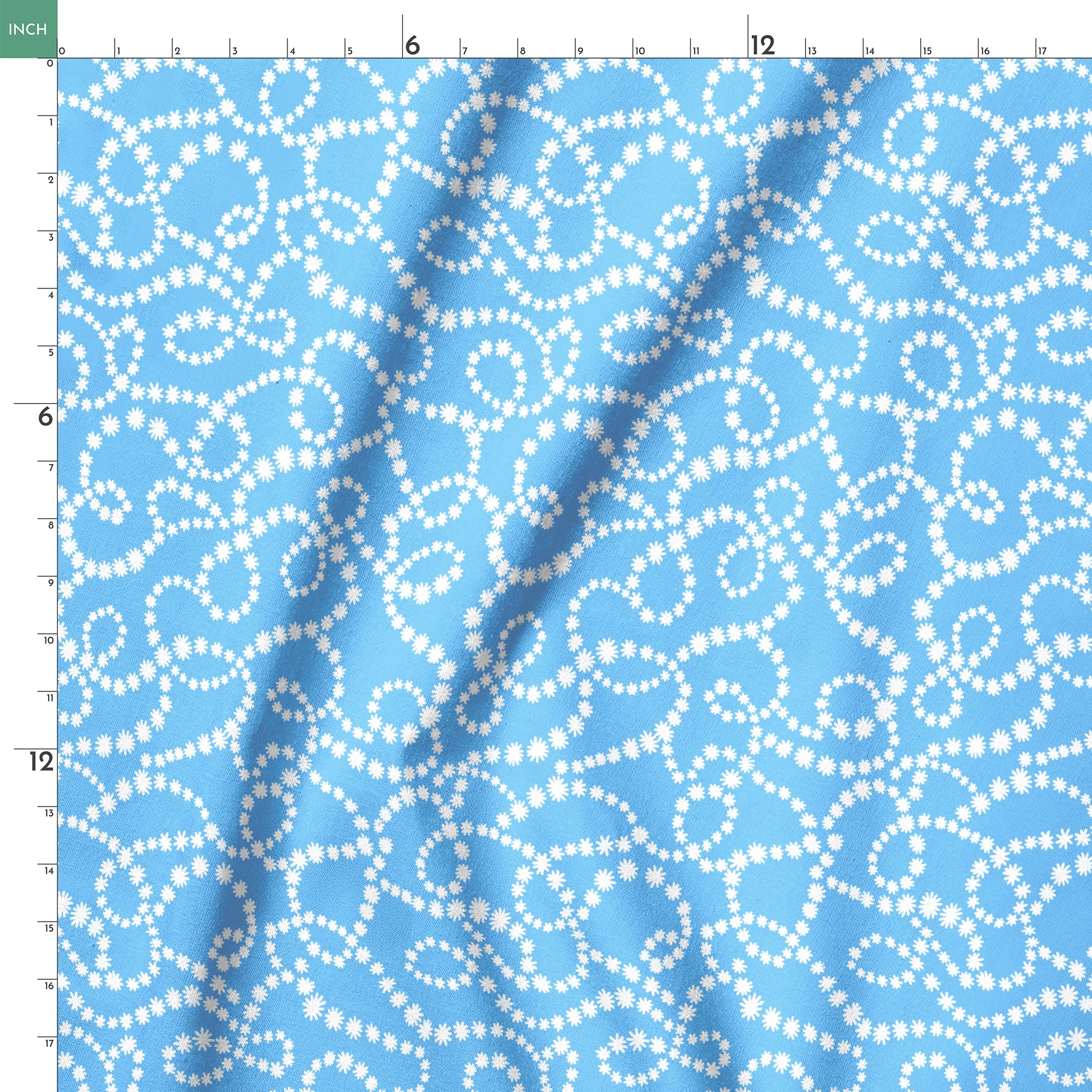 Sky blue background with swirling white dotted pattern resembling beaded strings or pearls arranged in curving lines springs ruler 18x18