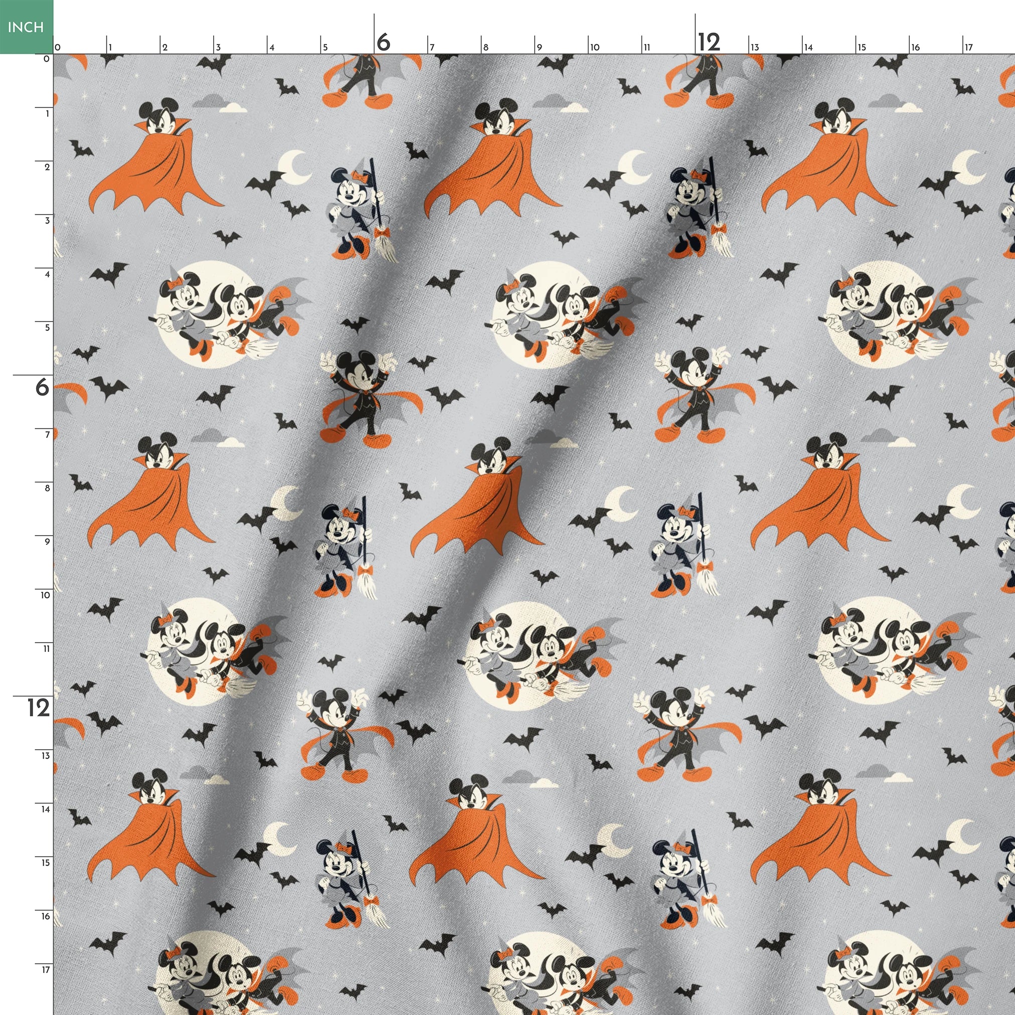 Mickey and Minnie Mouse in Halloween costumes on gray background with bats and moons, orange capes and spooky theme. springs ruler 18x18
