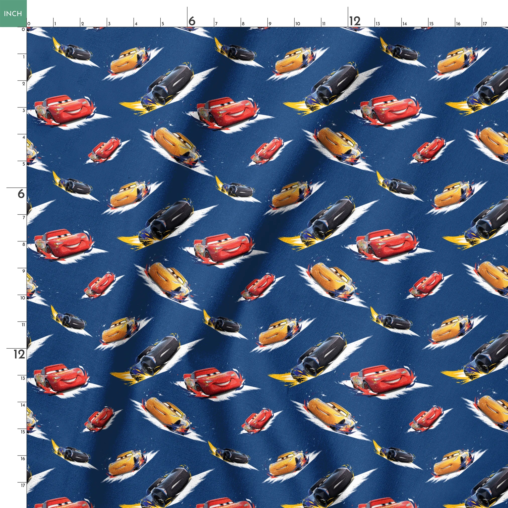 Animated race cars from Disney's Cars movie speeding across a blue background with white motion streaks springs ruler 18x18