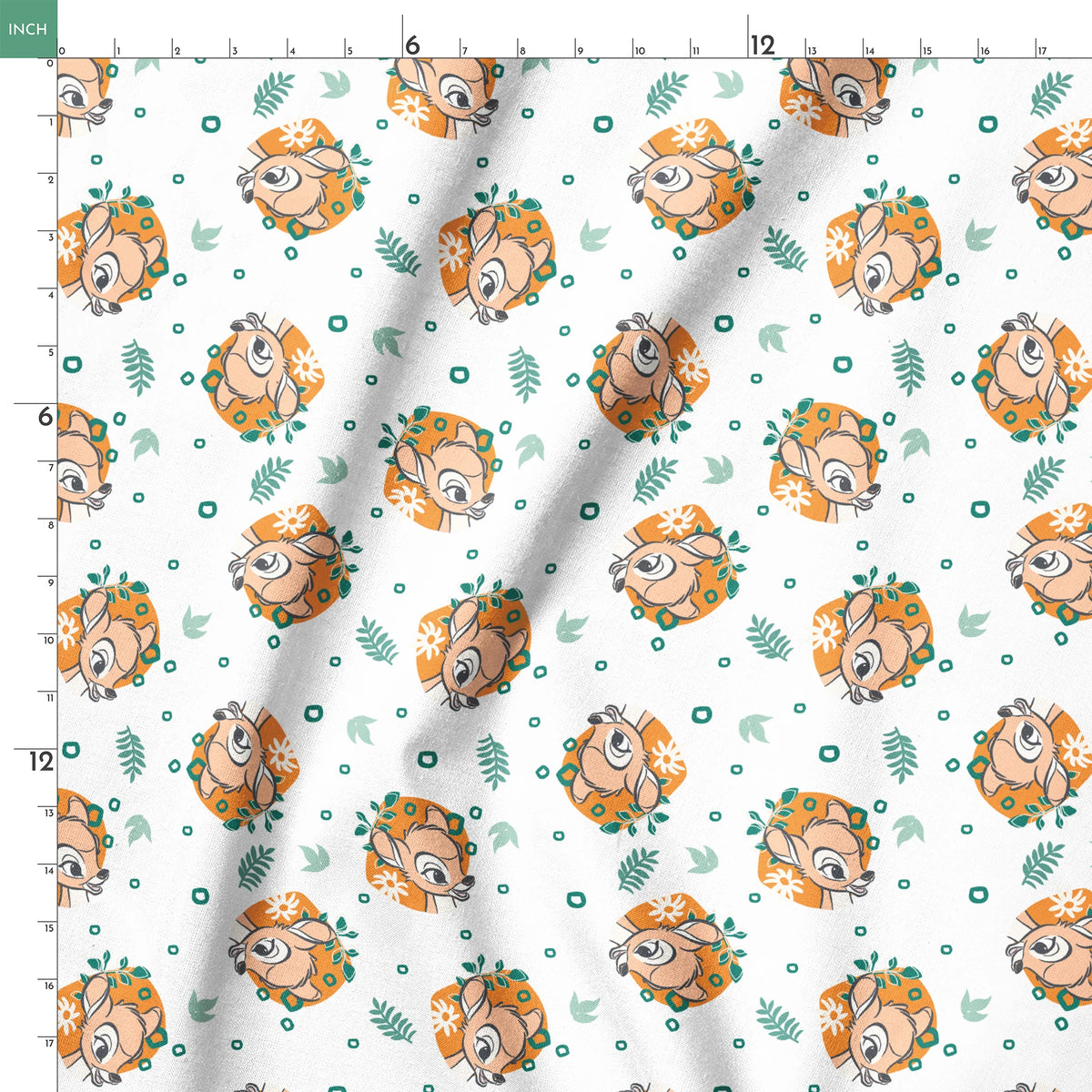 Disney’s Bambi illustrated in golden-orange floral medallions with green leaves and scattered geometric accents on a white background. springs ruler 18x18