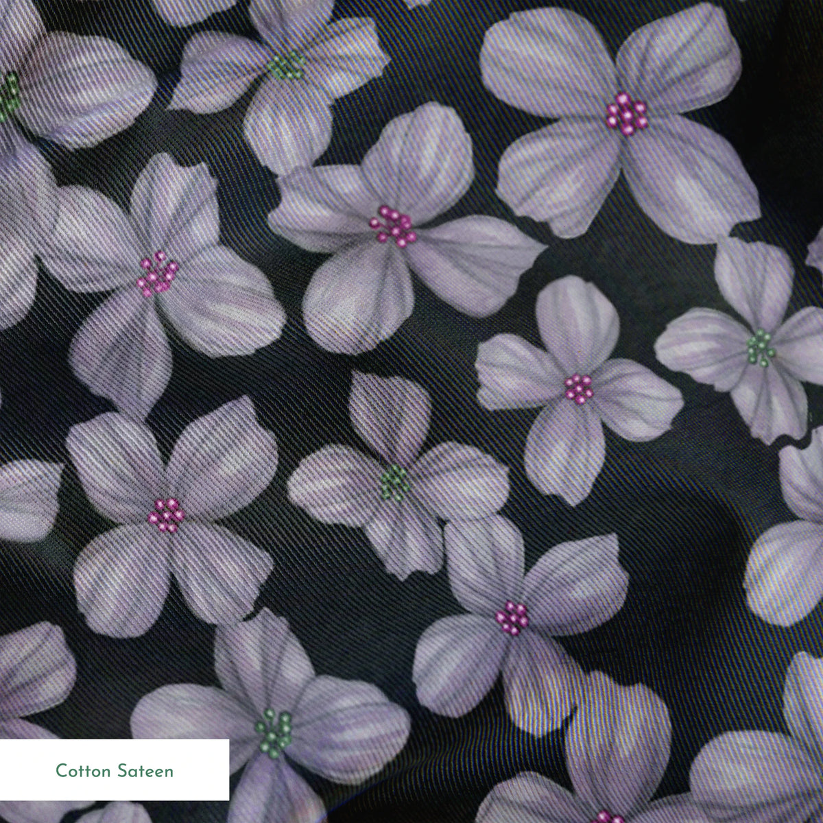 Hand-drawn purple flowers scattered on a charcoal background, designed by Nicole Tamarin. springs sateen texture