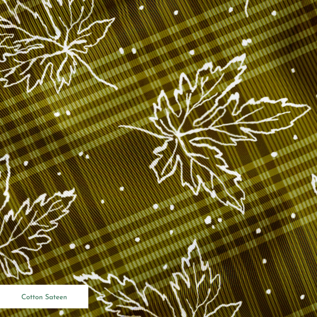 Olive green plaid pattern with scattered white outline maple leaves and small dots springs sateen texture