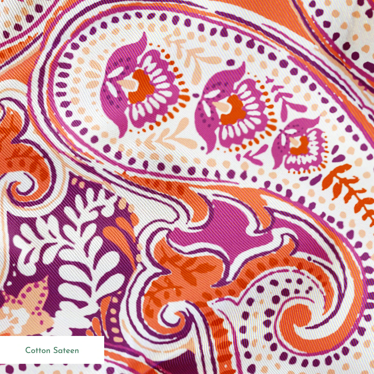 Vibrant paisley pattern in orange, pink and purple with swirling teardrop motifs and ornate details springs sateen texture