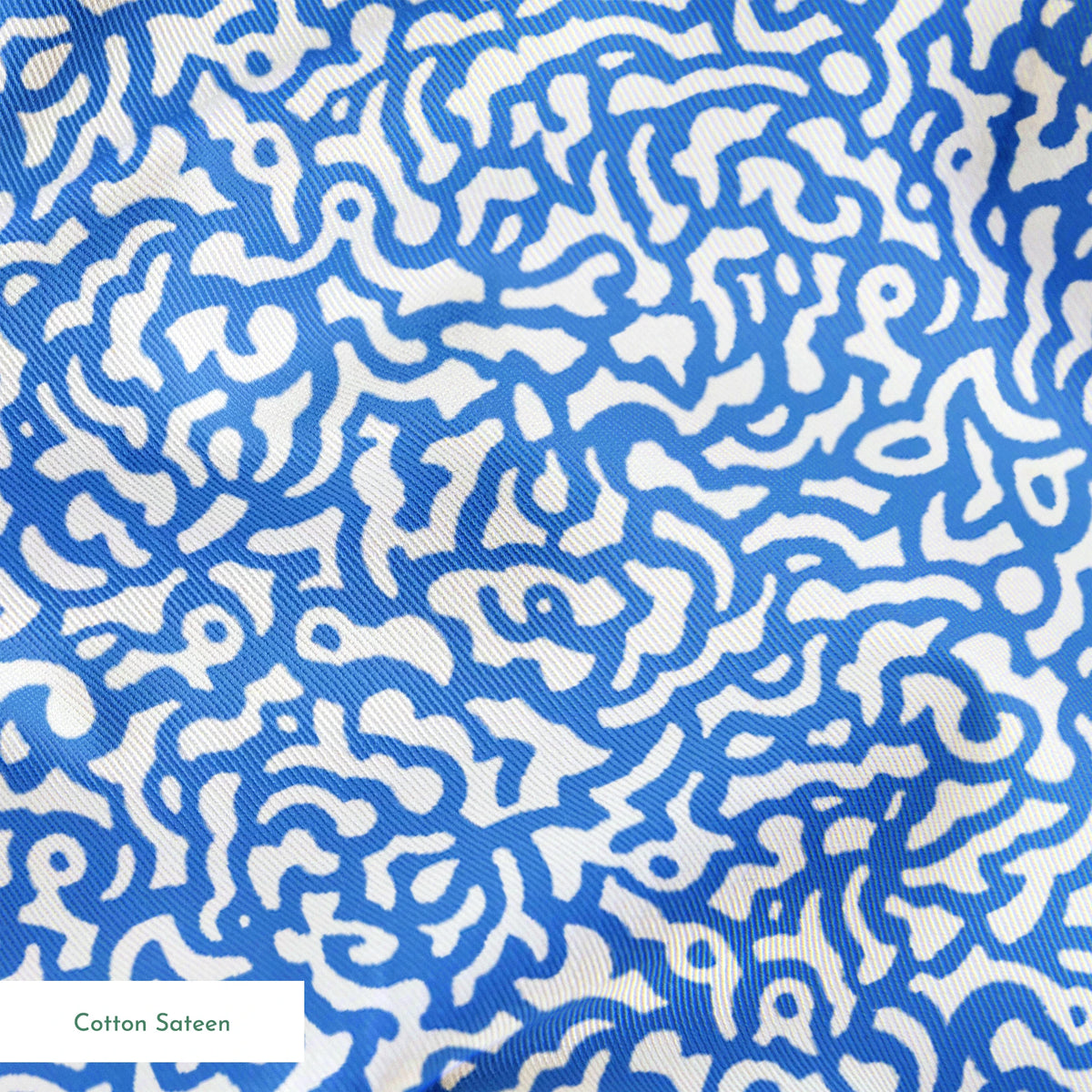 Blue and white abstract pattern with wavy, maze-like lines creating a flowing organic texture springs sateen texture