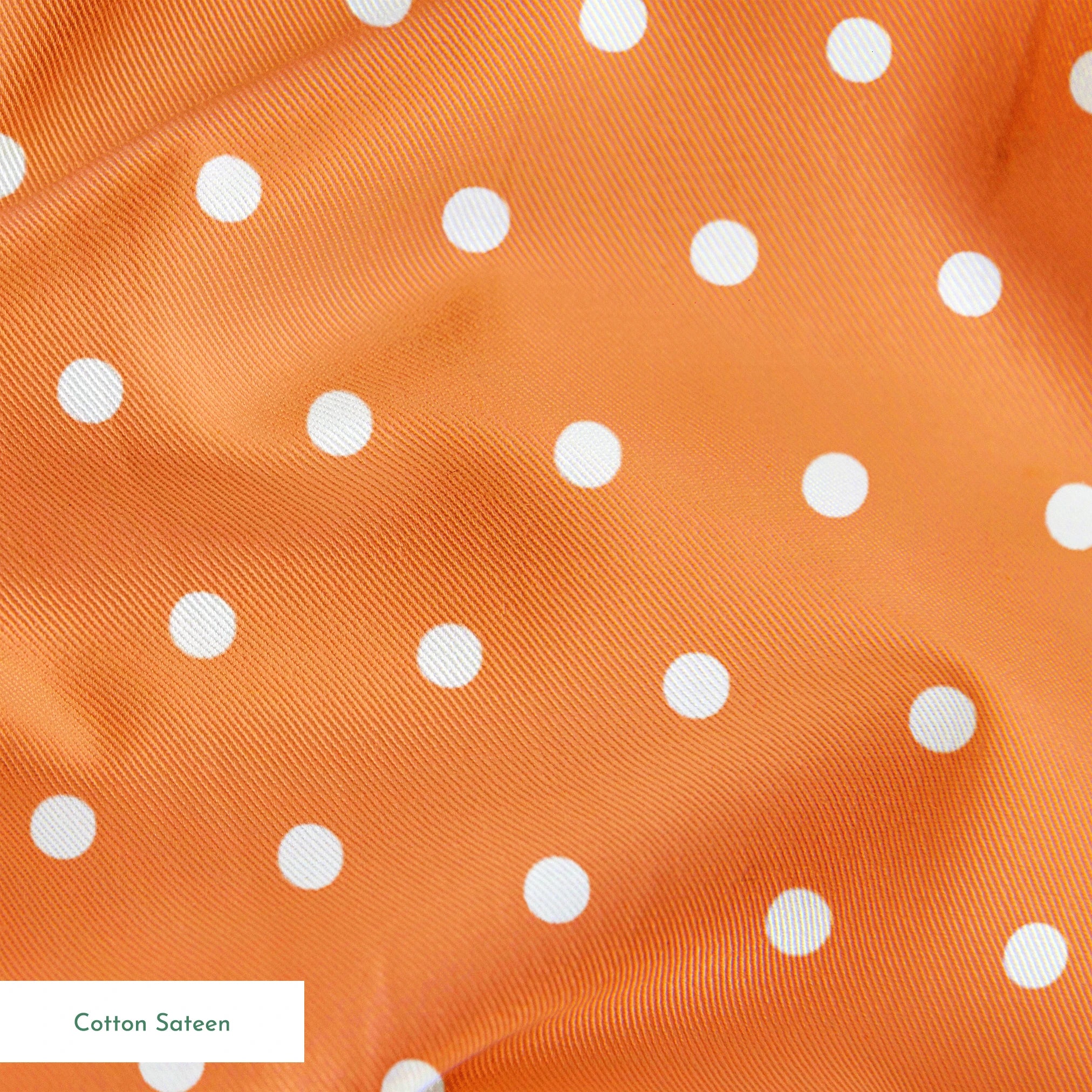 Two white circles on a bright orange background springs sateen texture