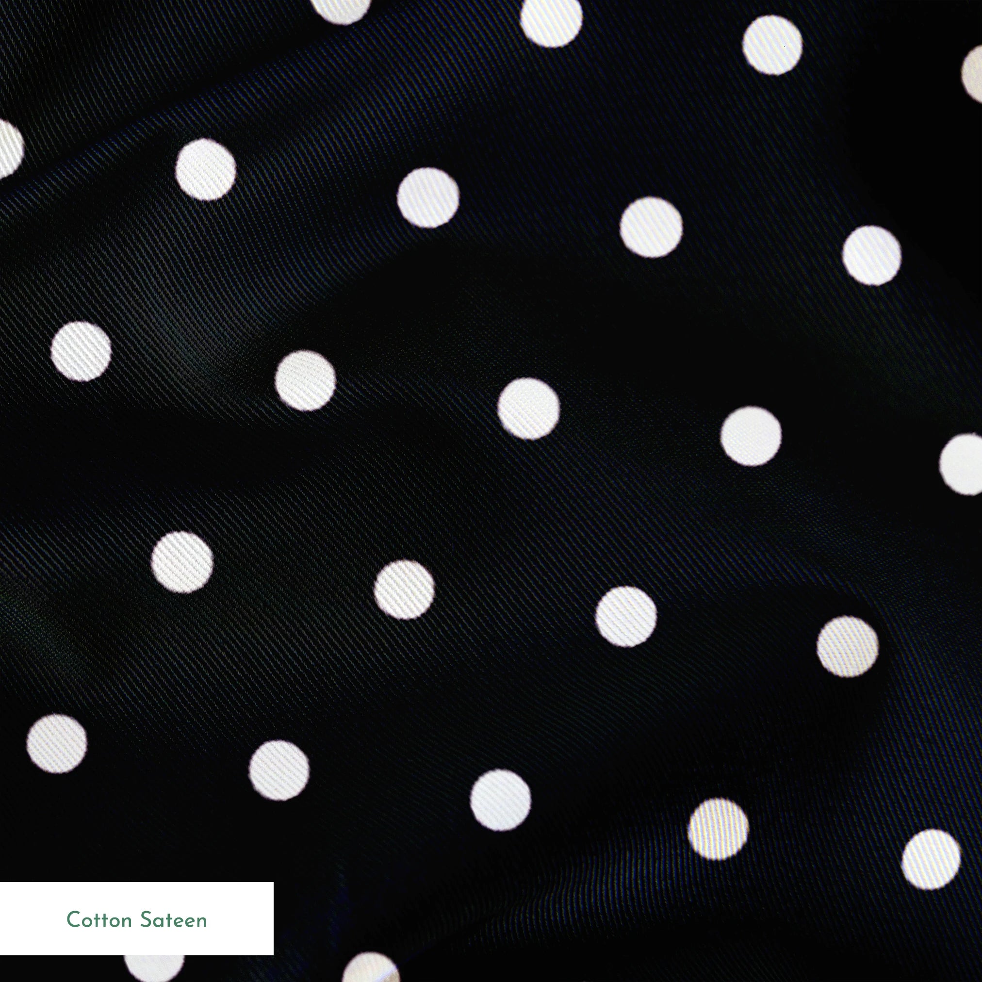 White circular dots on a black background springs sateen texture