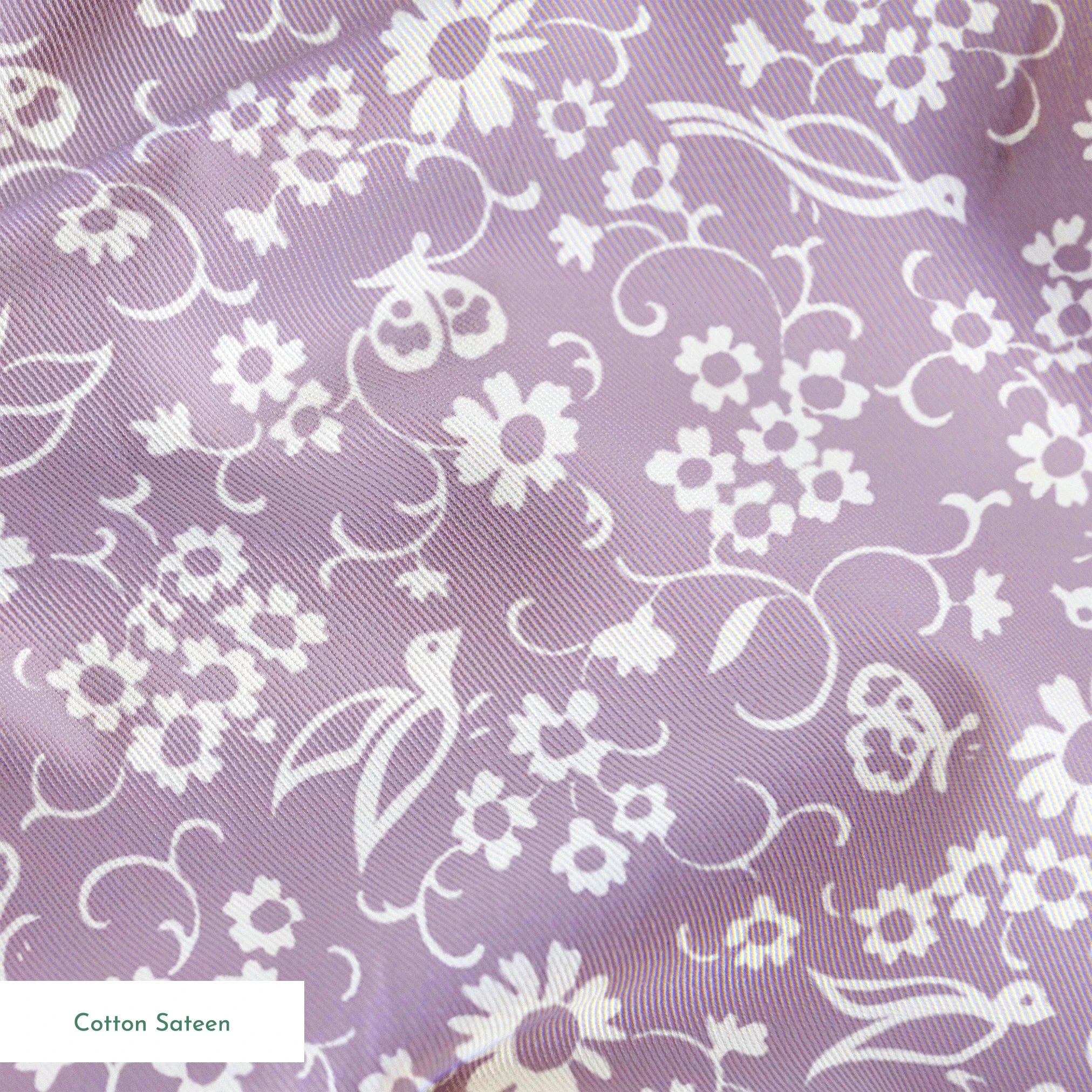White floral pattern on lavender purple background with daisies and decorative swirls springs sateen texture