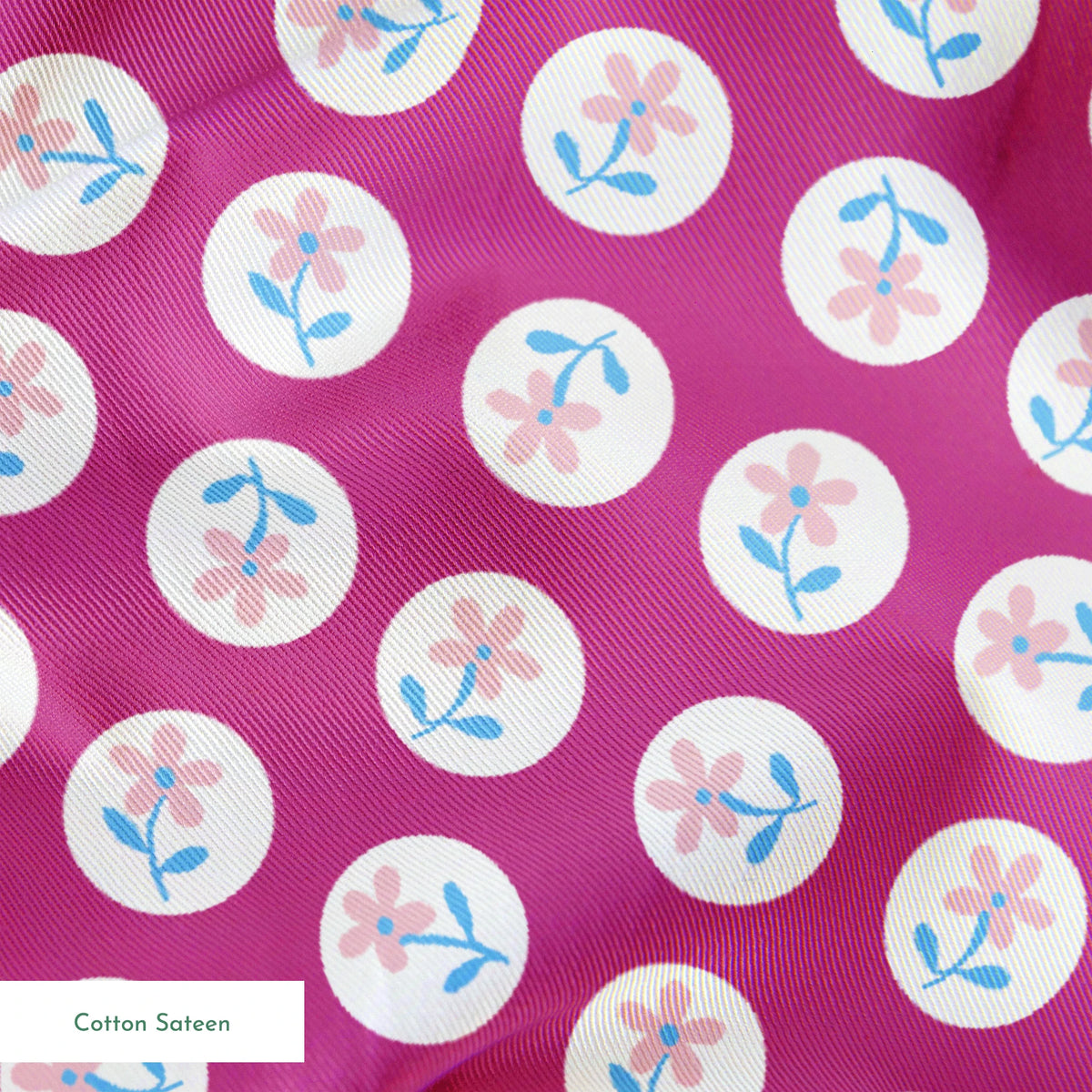 White circular dots with pink flowers and blue leaves pattern on vibrant magenta background springs sateen texture