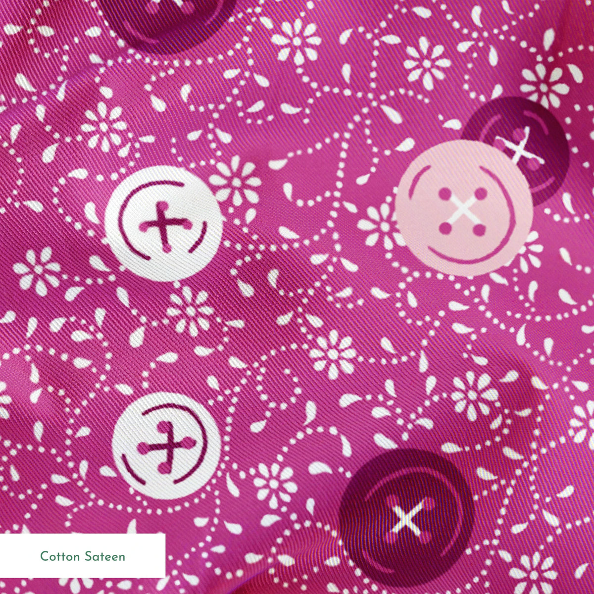 Magenta background with white floral pattern and buttons scattered throughout springs sateen texture
