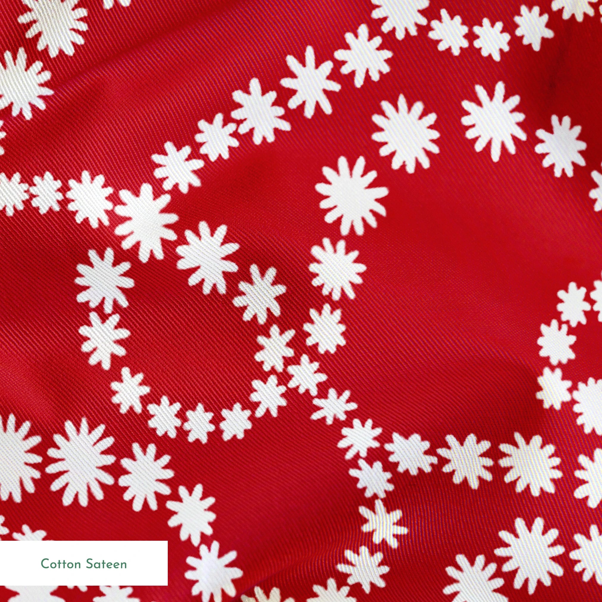 White dotted swirl pattern on rich red background creating decorative curving lines springs sateen texture