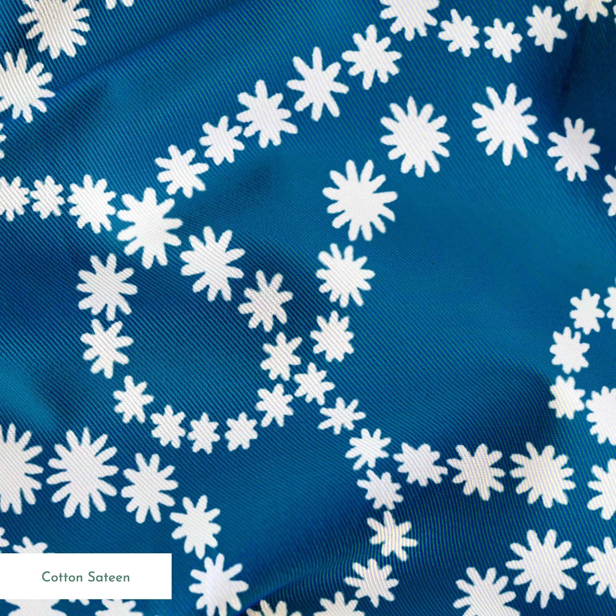 Dotted white swirling patterns on deep teal blue background creating abstract curved designs springs sateen texture