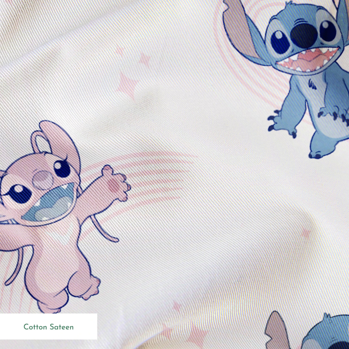 Cartoon pattern of blue and pink Stitch characters from Lilo & Stitch with playful poses on pale background springs sateen texture