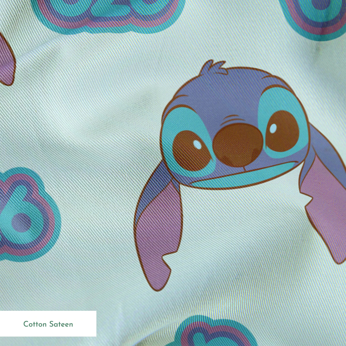 Blue cartoon creatures with large ears and swirl patterns on light teal background springs sateen texture