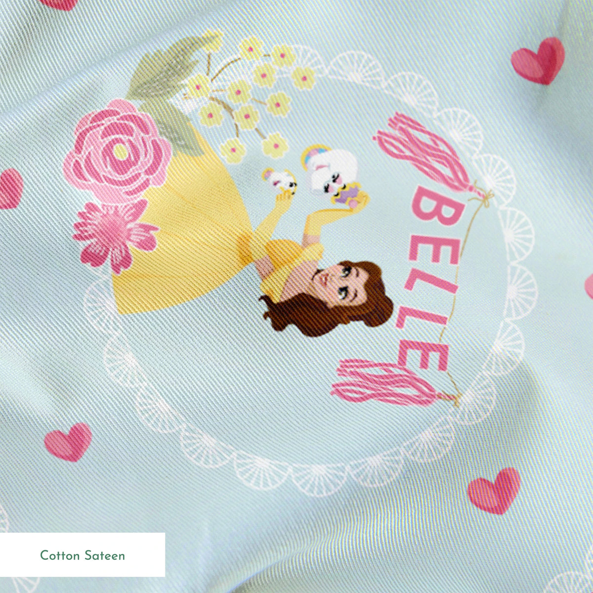 Princess Belle pattern with yellow dress, "Belle" text, hearts, and flowers on light blue background springs sateen texture