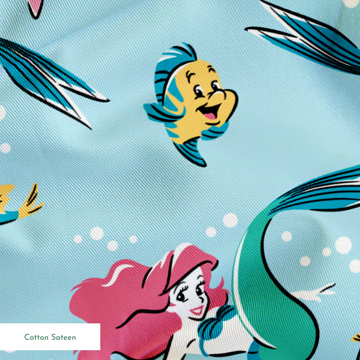 Underwater pattern with colorful mermaids, tropical fish, crabs, and starfish on light blue background springs sateen texture