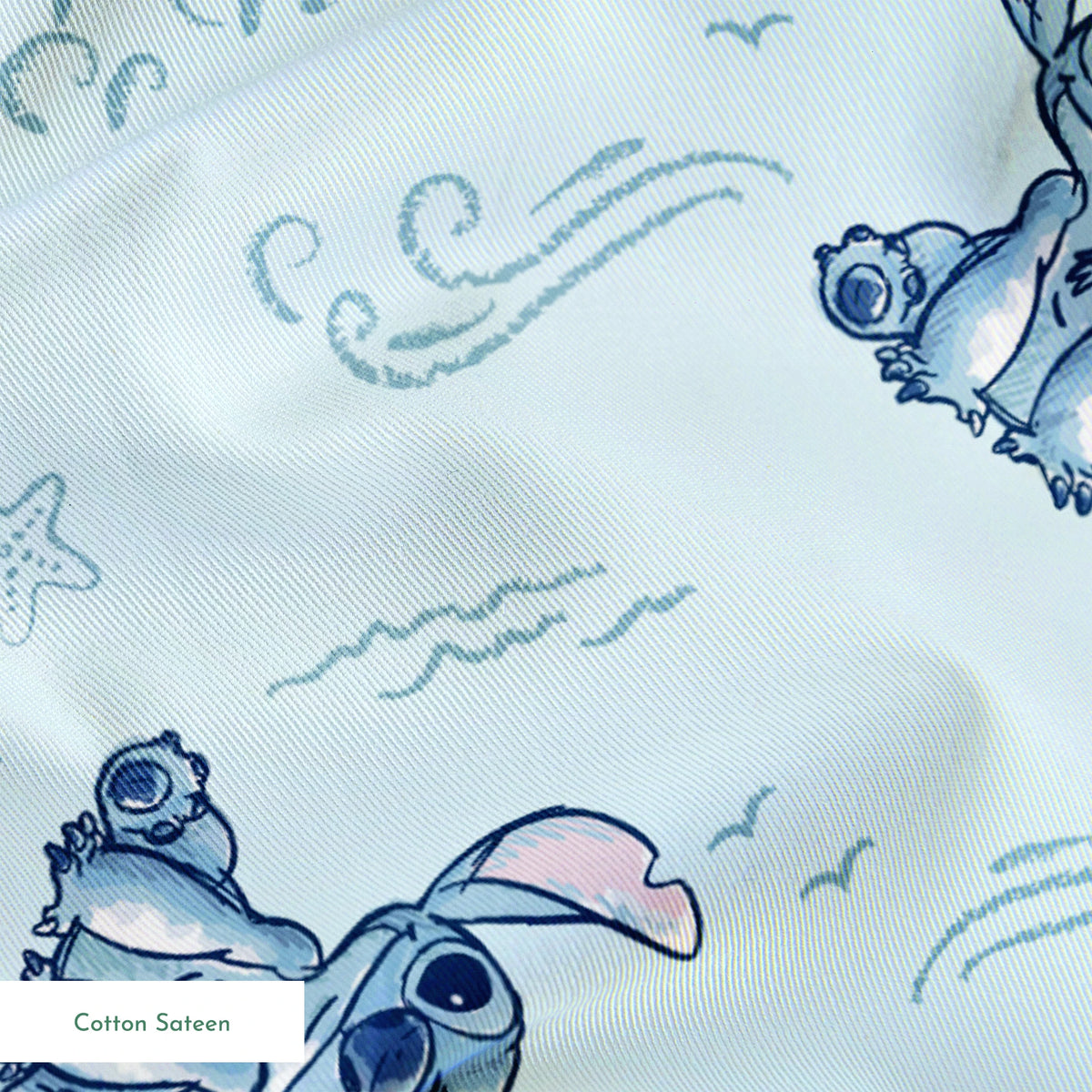 Blue cartoon alien characters with large ears in playful poses against light blue background with swirls and stars pattern springs sateen texture