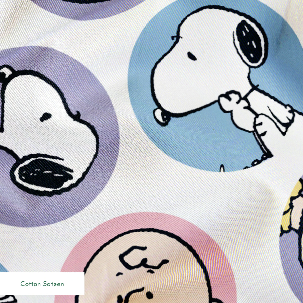 Peanuts cartoon pattern with Charlie Brown and Snoopy circular portraits in pink, blue and purple springs sateen texture