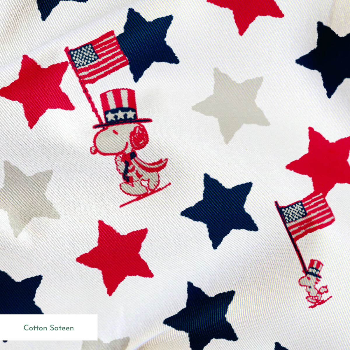Peanuts Patriotic pattern with red, white, and blue stars alongside American flag poles on white background springs sateen texture