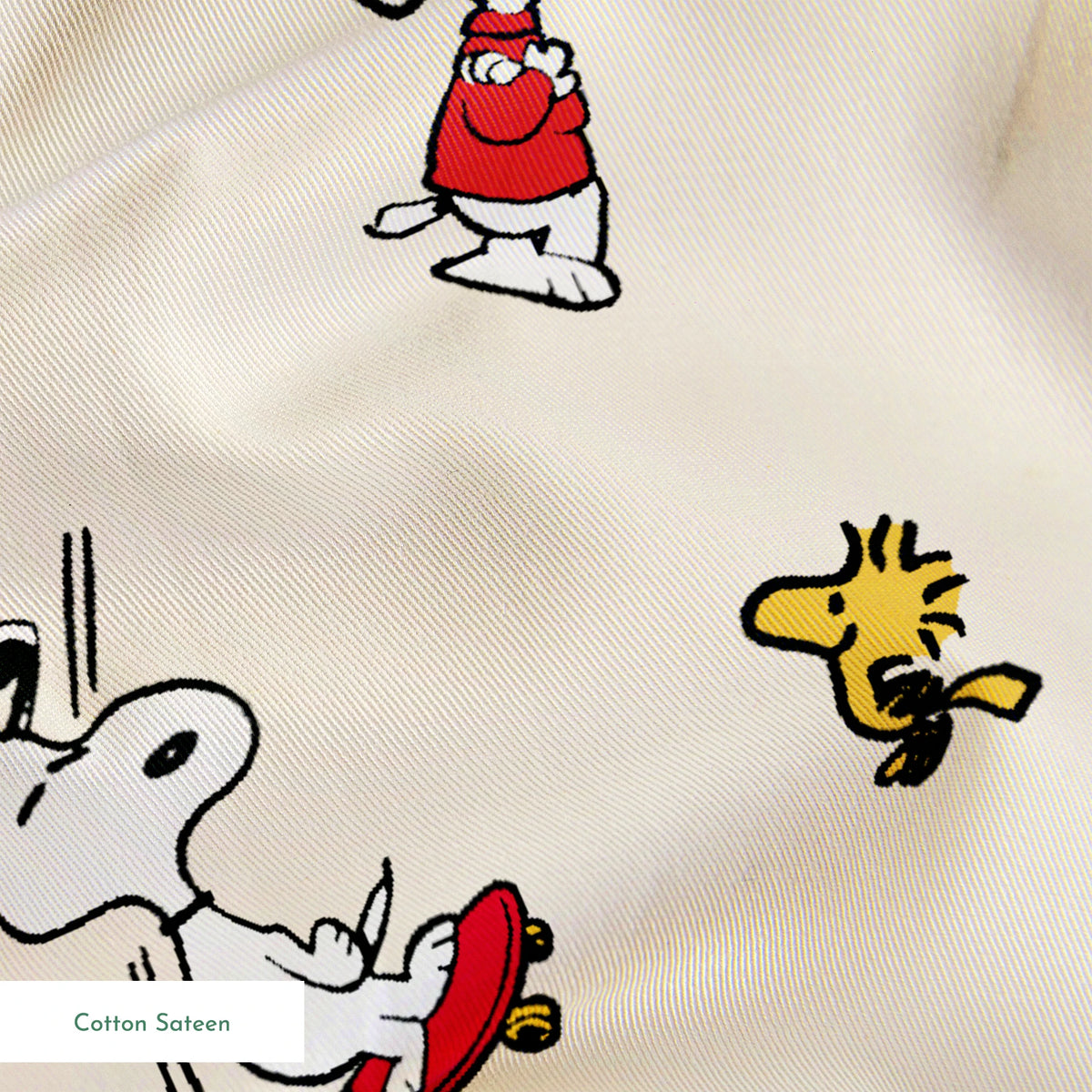 Snoopy and Woodstock on cream background, arranged in pattern springs sateen texture