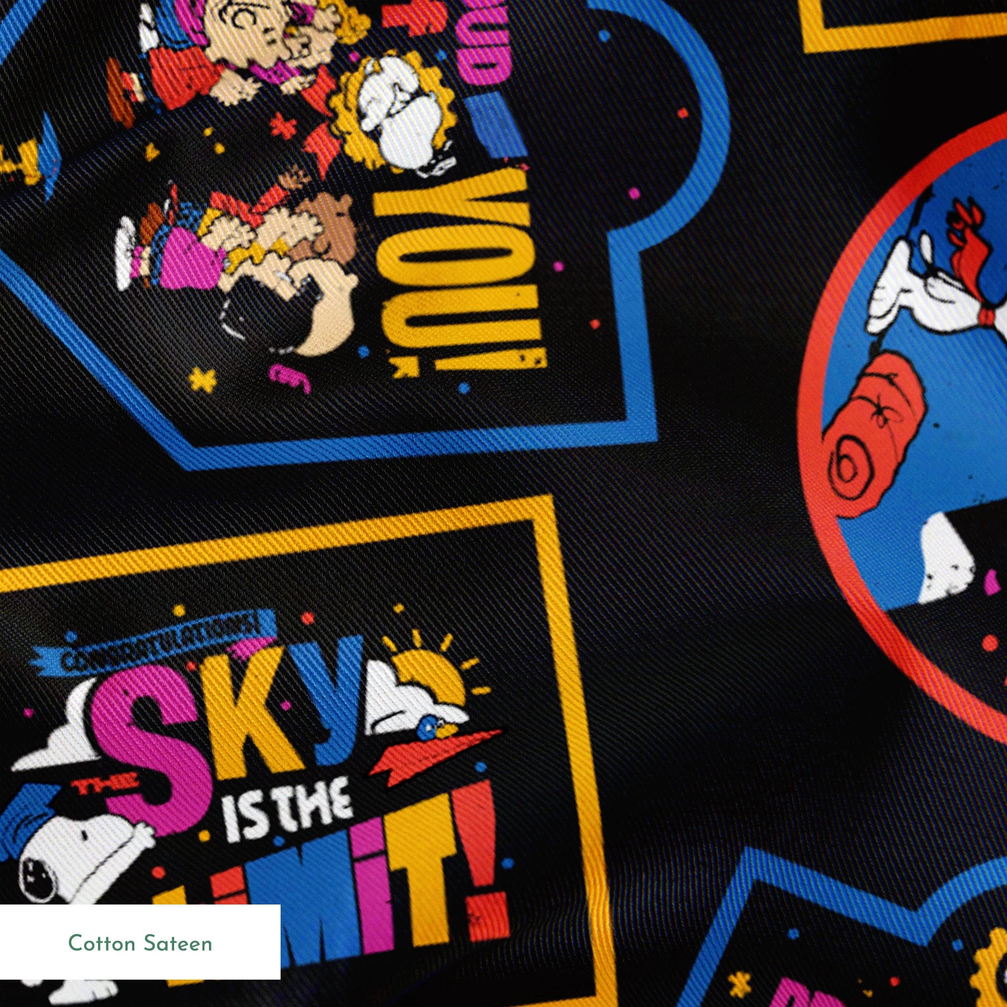 Colorful Peanuts character patches in various shapes on black background, featuring animated figures in vibrant colors springs sateen texture