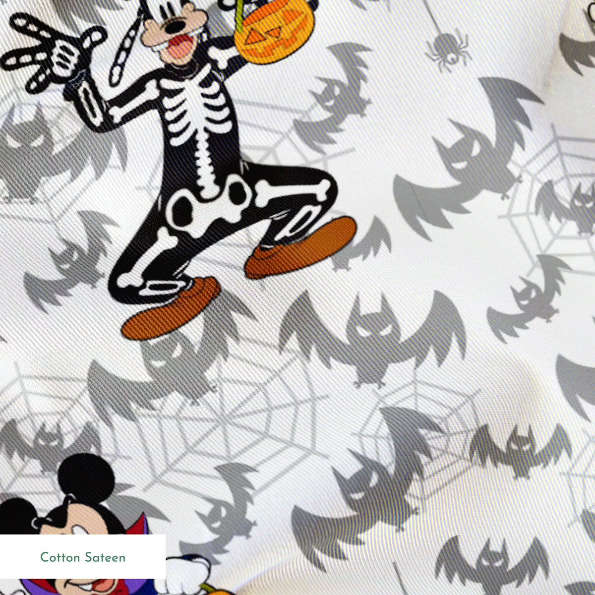 Disney cartoon characters in Halloween costumes with pumpkins on bat pattern background springs sateen texture