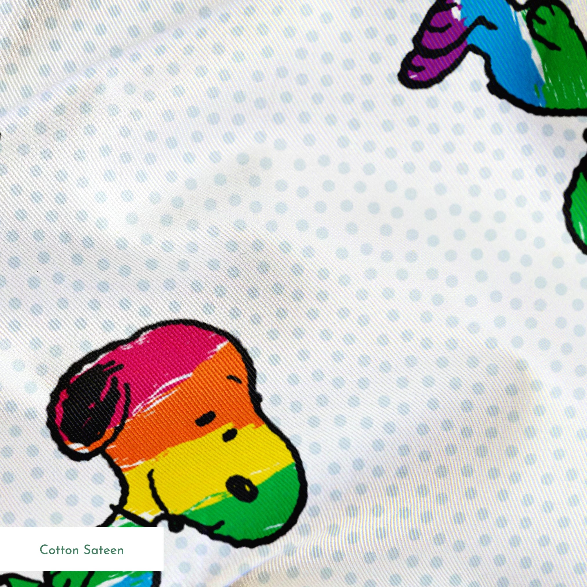 Colorful rainbow Snoopy in various poses on a dotted white background springs sateen texture