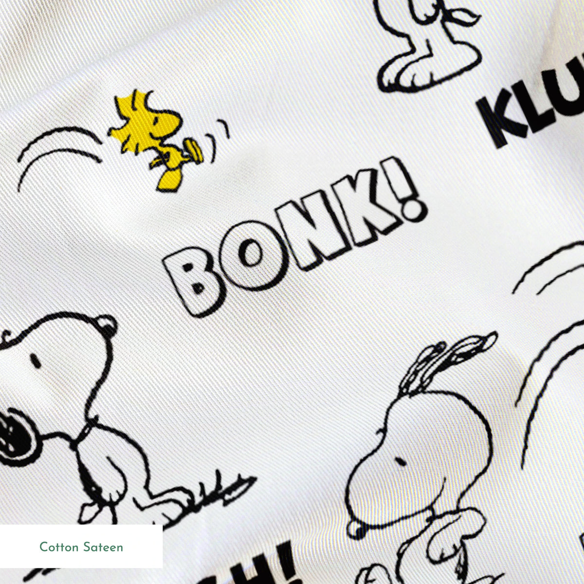 Comic-style pattern of Snoopy and Woodstock with sound effect words like "BONK!", "KLUNK!" and "BUMP!" in black and white. springs sateen texture