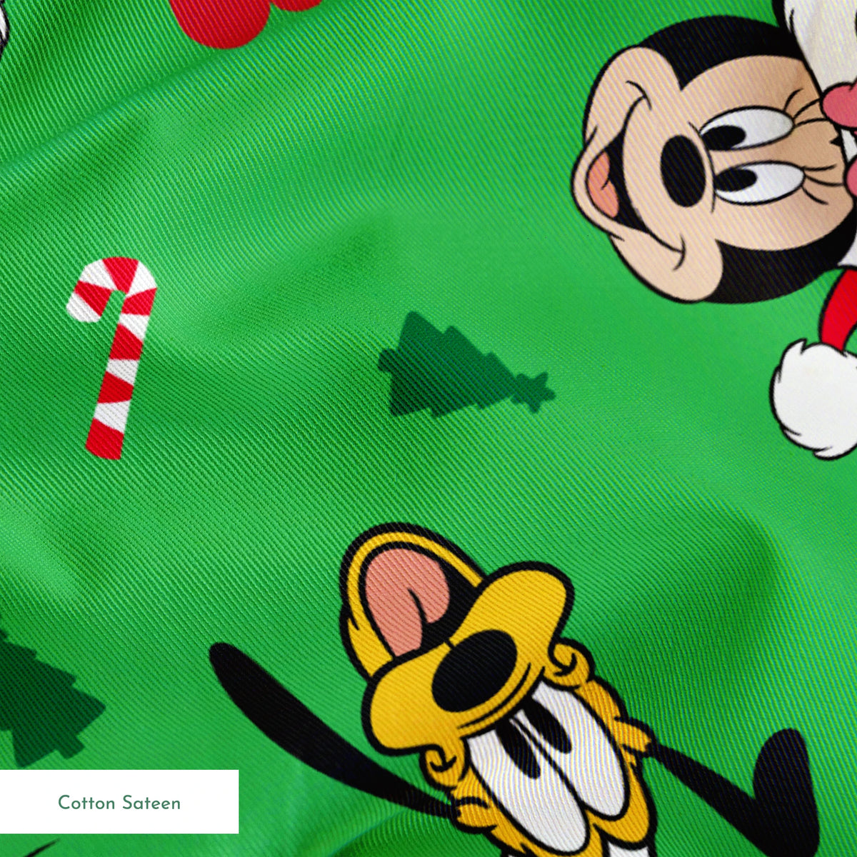 Disney Mickey Mouse characters in Santa hats on green background with candy canes and Christmas trees springs sateen texture