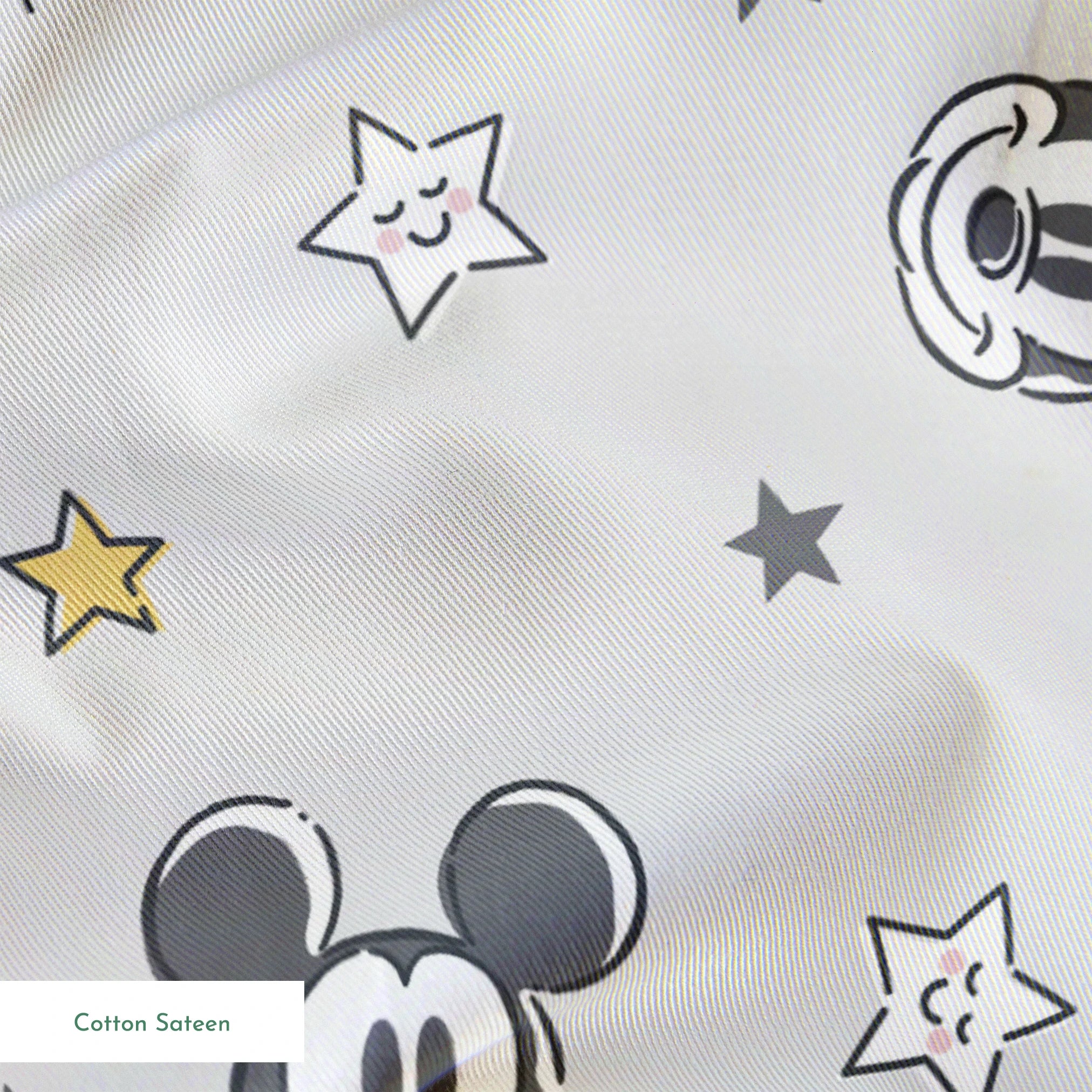 Mickey and Minnie Mouse pattern with stars on light gray background springs sateen texture