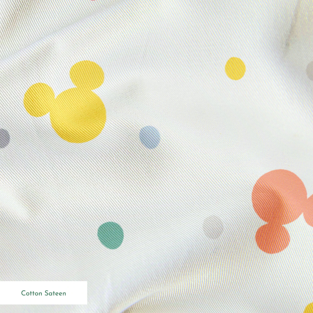 Colorful Disney Mickey Mouse silhouette pattern with pastel dots on white background springs sateen texture