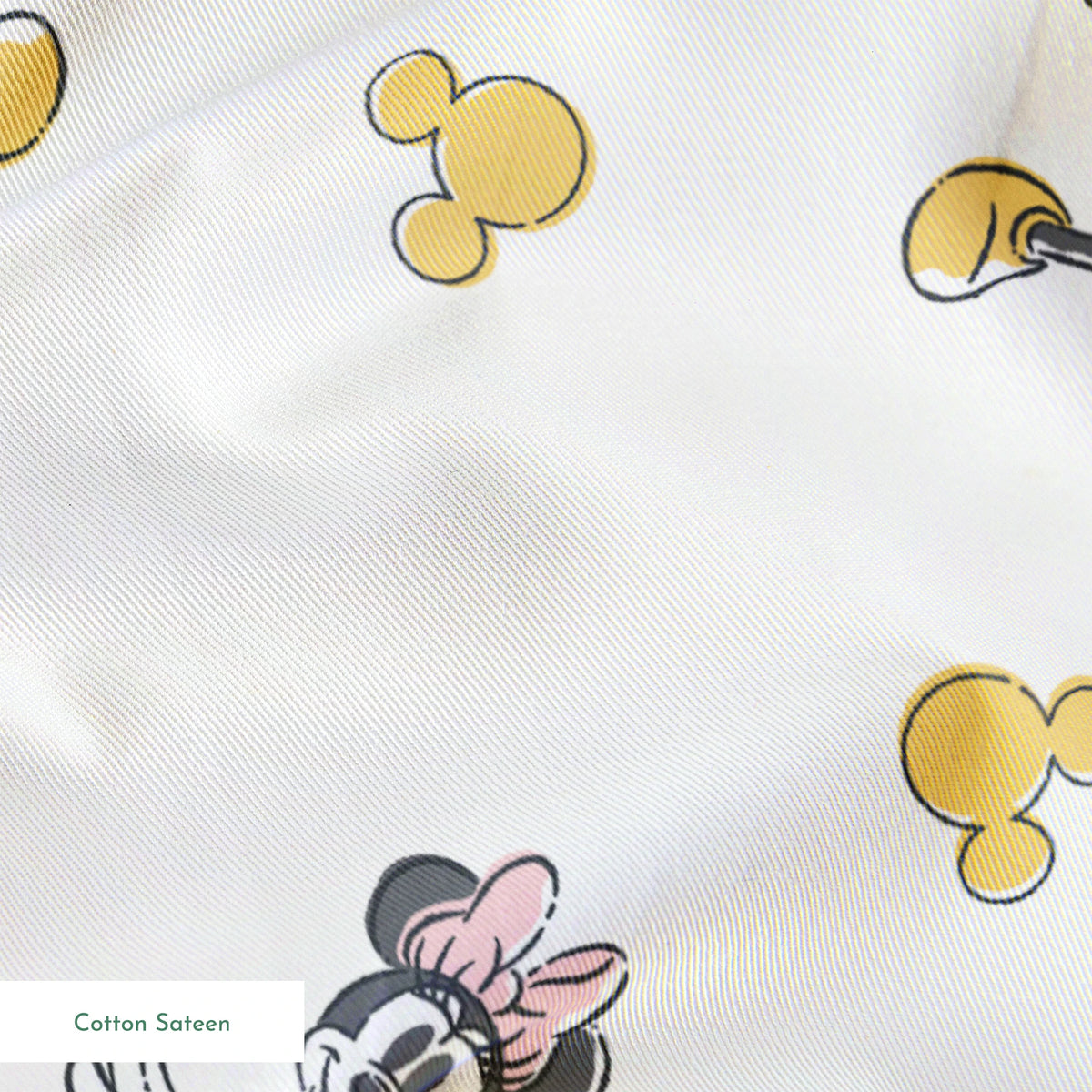 Mickey Mouse characters in light blue outfits scattered on white background with yellow Mickey silhouettes springs sateen texture