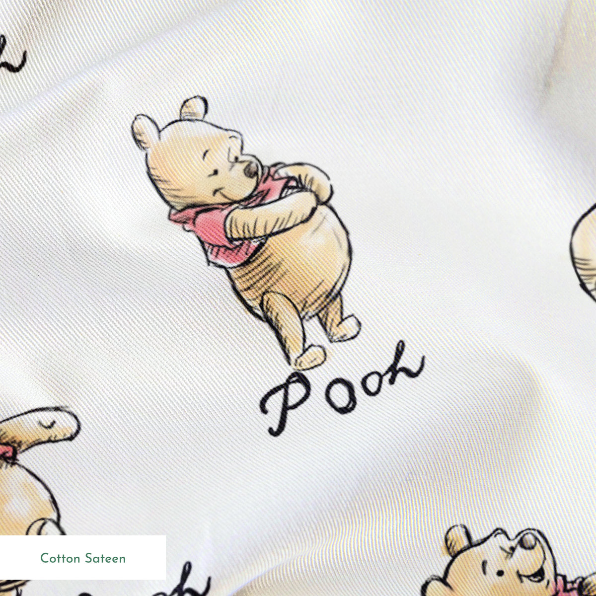 Winnie the Pooh pattern featuring cute yellow bears with red shirts in various poses, labeled "Pooh springs sateen texture