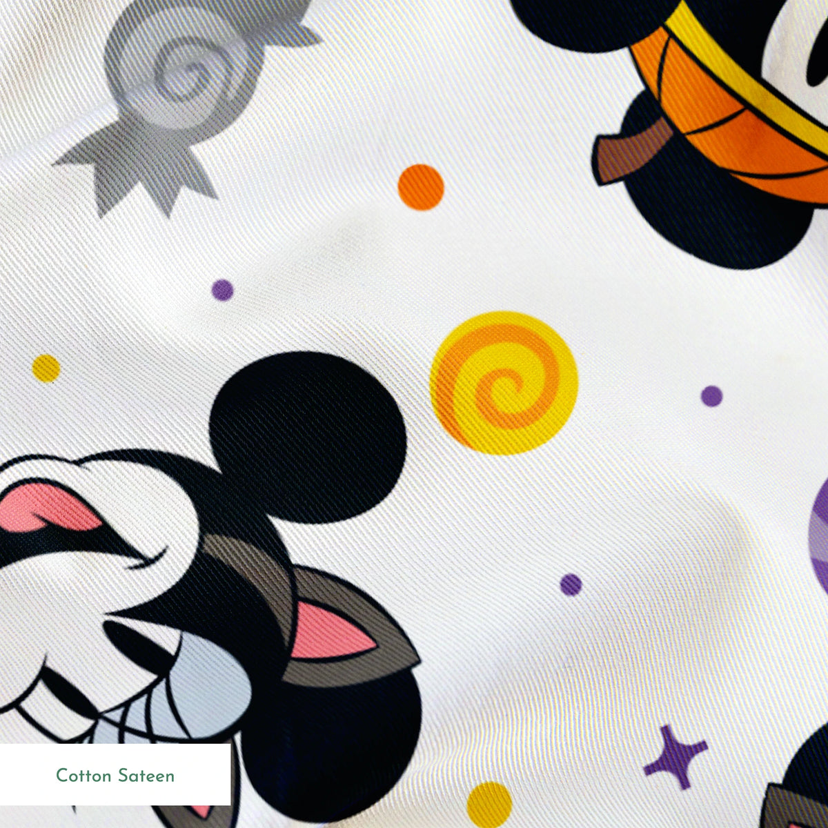 Mickey and Minnie Mouse cartoon heads scattered with wrapped candies and colorful dots on white background springs sateen texture