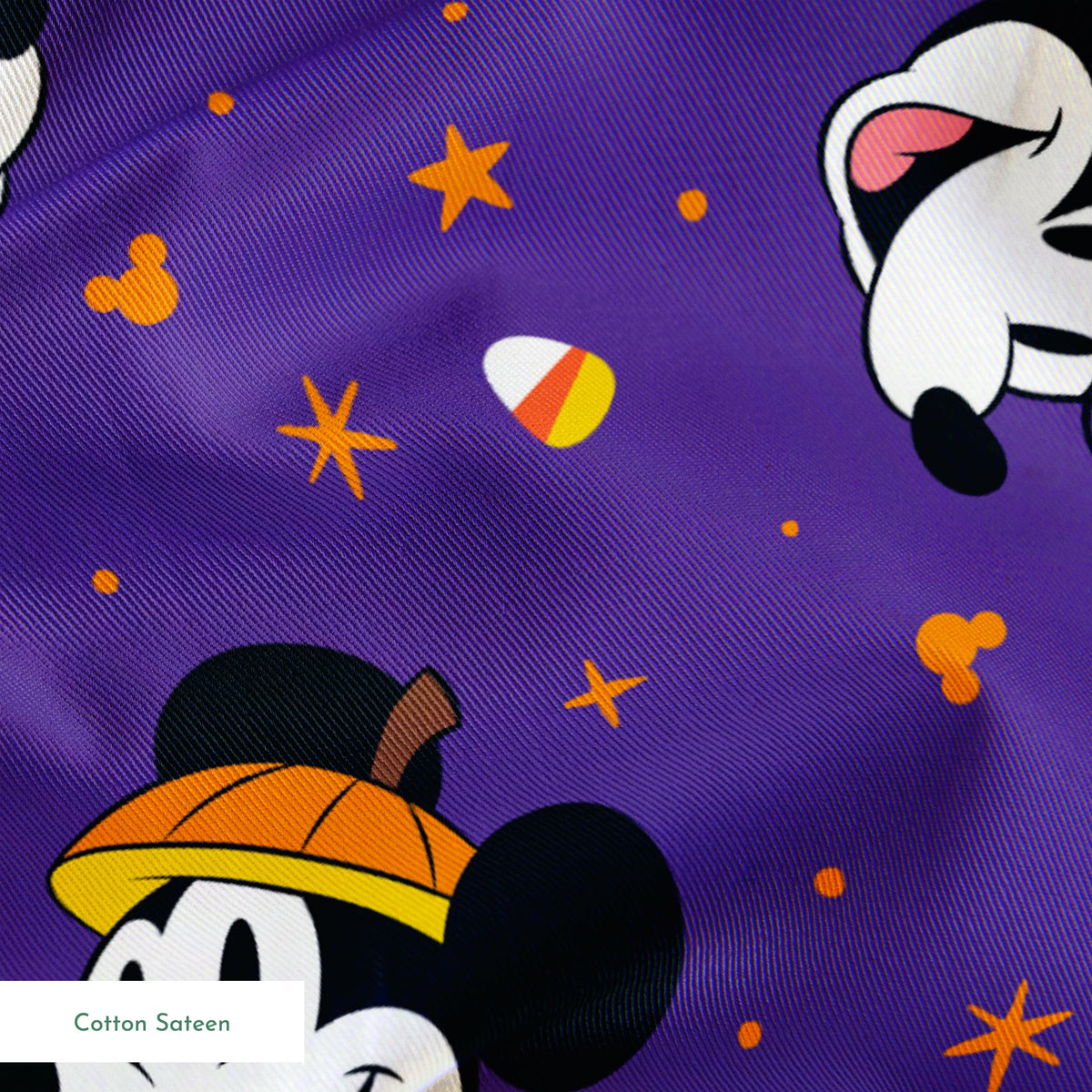 Mickey Mouse Halloween pattern with candy corn and stars on purple background springs sateen texture