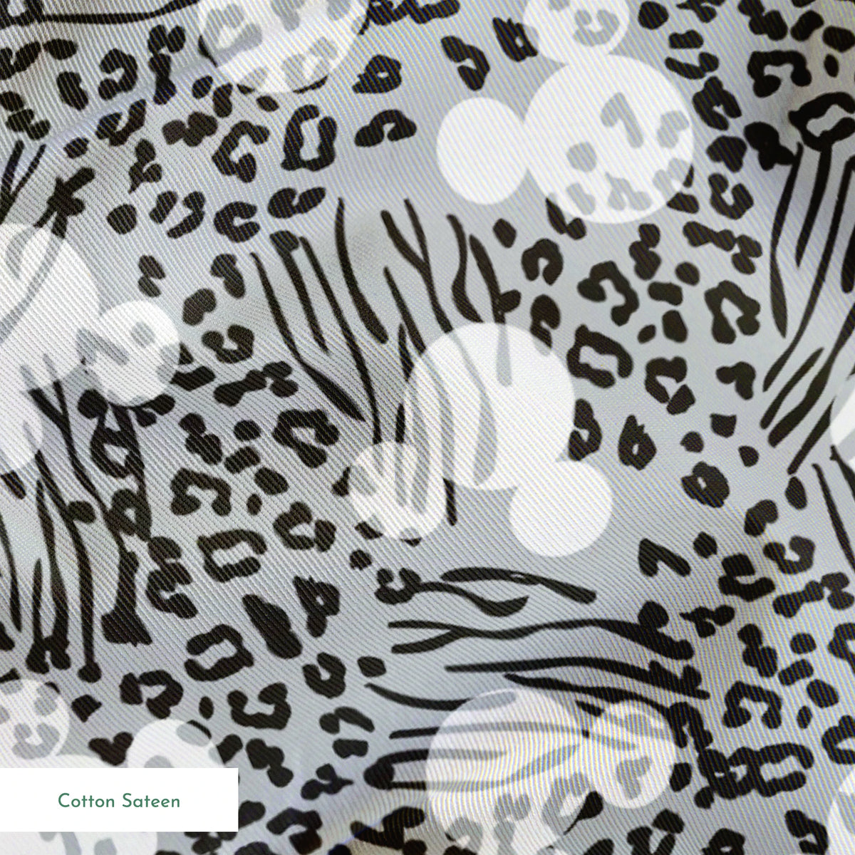 Animal print pattern with zebra stripes and leopard spots in black and white on gray background springs sateen texture