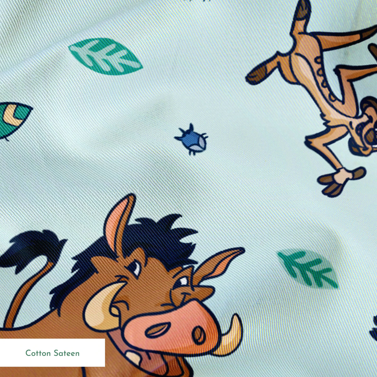 Lion King characters and colorful leaves scattered on light blue background in playful pattern springs sateen texture