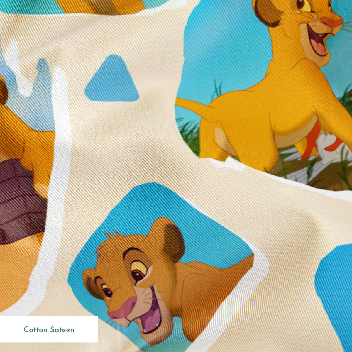 Young lion cub characters from The Lion King in a repeating pattern on cream background springs sateen texture