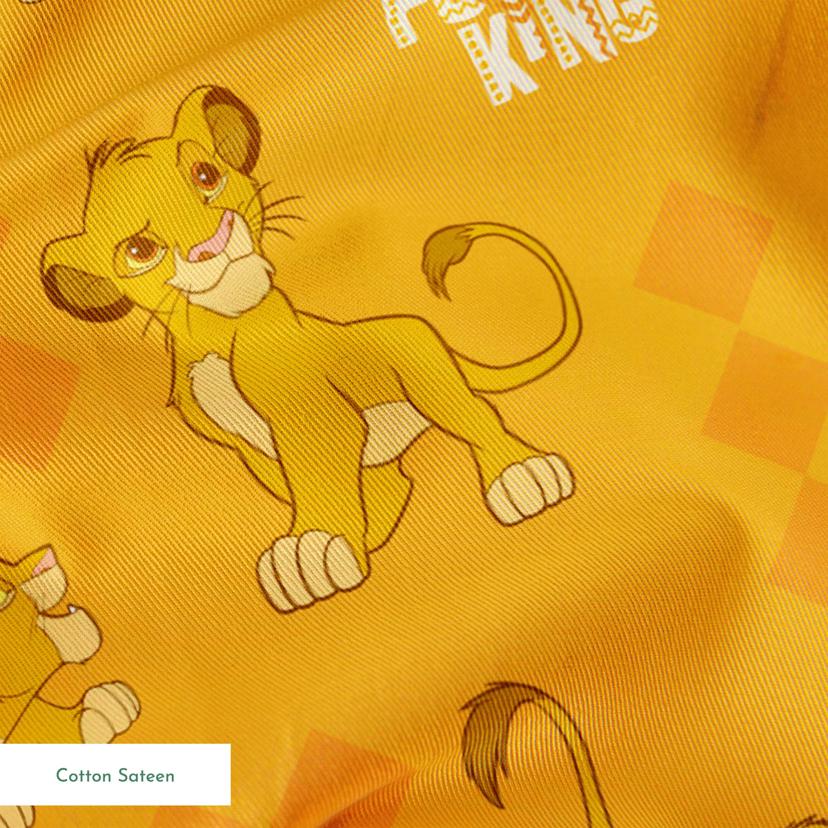 Young lion cub cartoon pattern on orange diamond background with "Future King" text springs sateen texture