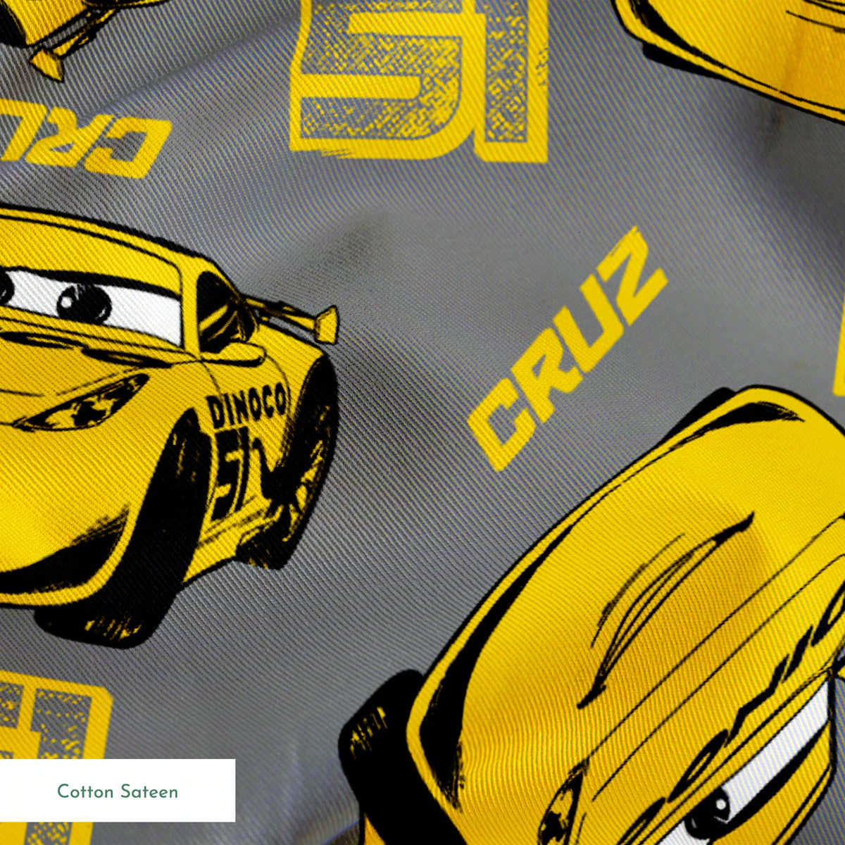 Yellow cartoon race cars with Cruz name on gray background, Cars movie pattern springs sateen texture