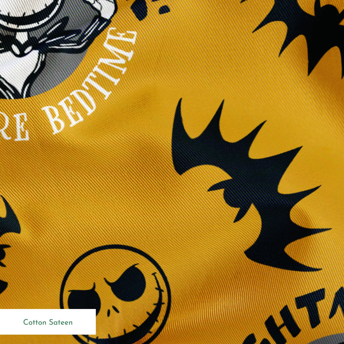 Halloween pattern with skeletal figure, "Nightmare" text, yellow background, black bats and smiling faces springs sateen texture