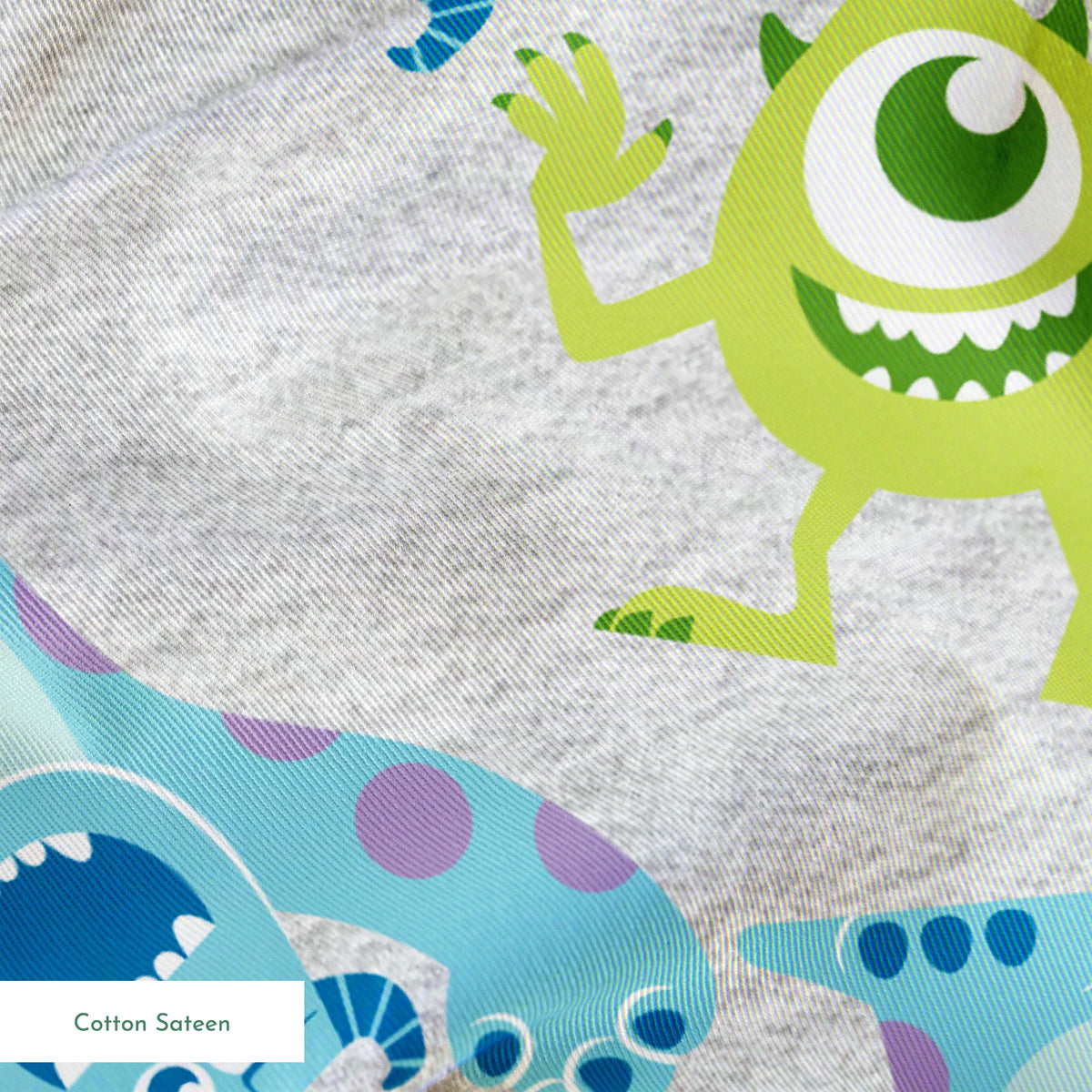 Cartoon pattern of Monsters Inc characters on light gray background springs sateen texture