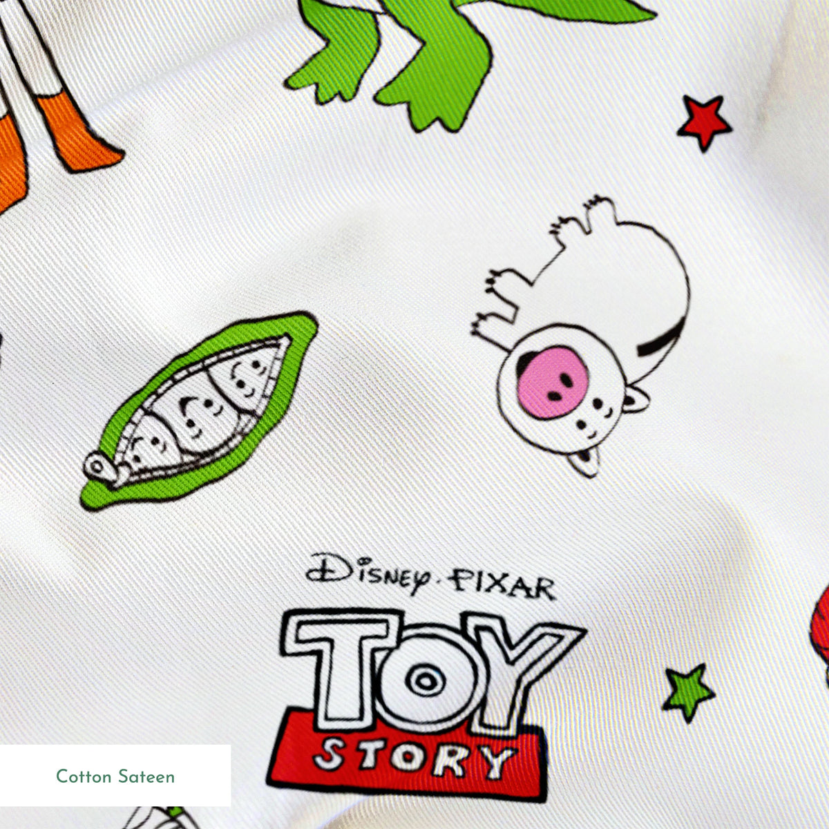 Toy Story pattern with Rex, Buzz, Woody, and alien characters scattered on white background springs sateen texture