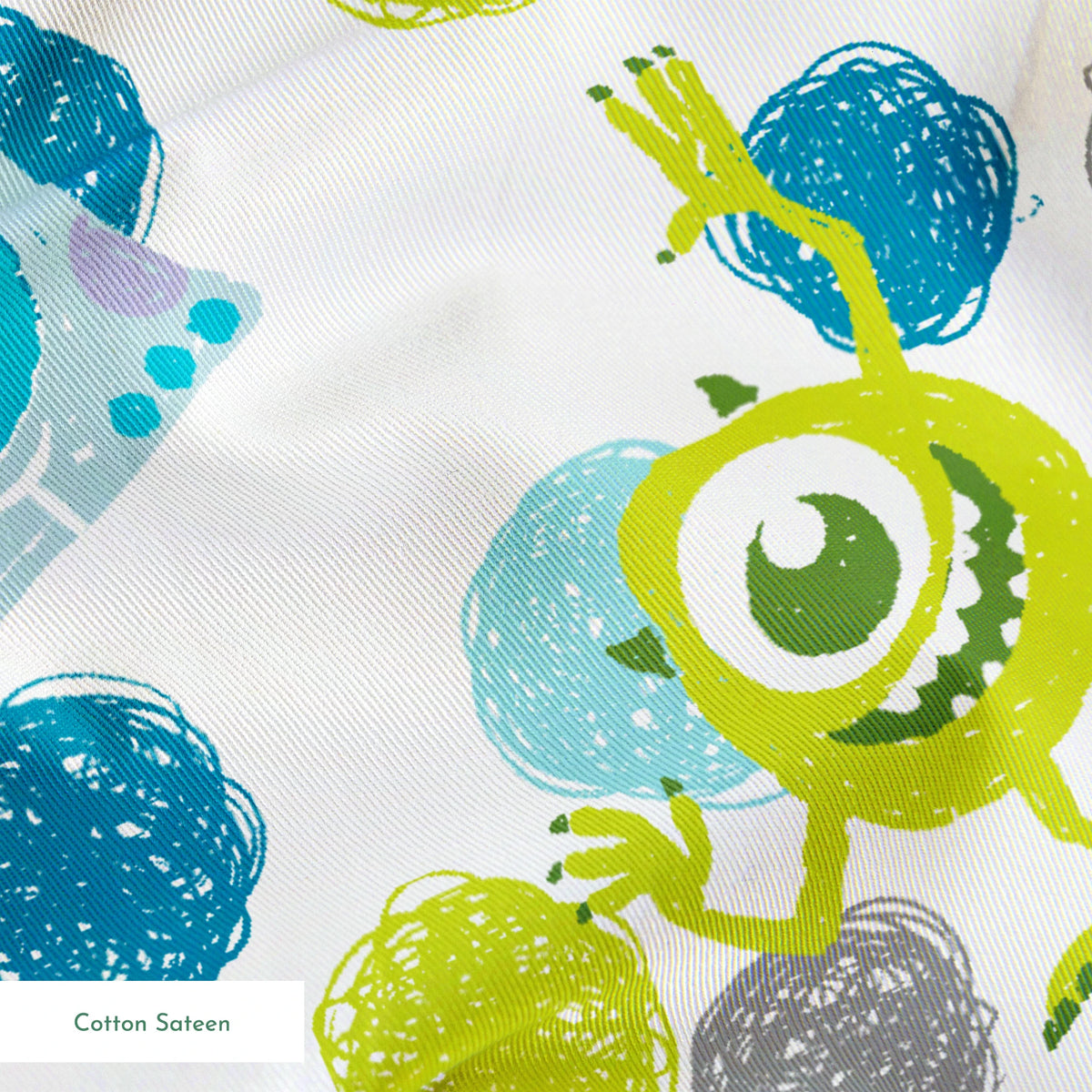 Colorful pattern featuring cartoon monsters with polka dots in blue, green, and purple on white background springs sateen texture
